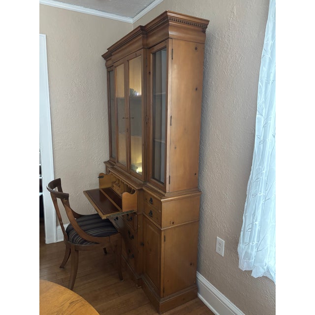 Beautiful vintage solid pine secretary china cabinet featuring classic proportions and exceptional storage. This...