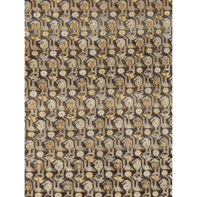A vintage Persian Malayer Gallery carpet. The chocolate field features a geometric small boteh pattern and similarly...