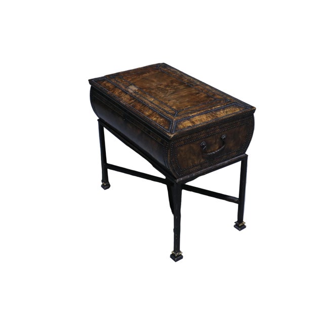 Wonderful antique sewing box on cast iron raised legs with a burl walnut outer shell. The outside of the box is studded in...