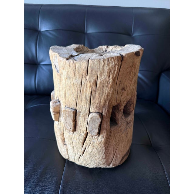 Exceptional carved wooden wheel hub with a substantial, primitive form and remarkable natural surface character. The piece...