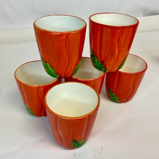 This is a set of 6 ceramic low ball glasses in the Trompe L’Oeil style of tomatoes. Perfect for a tomato juice serving set...