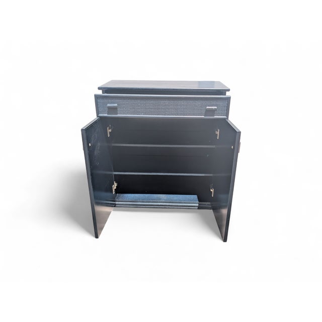 This refined wicker cabinet combines craftsmanship and functionality in a simple yet elegant design. Featuring hand-woven...