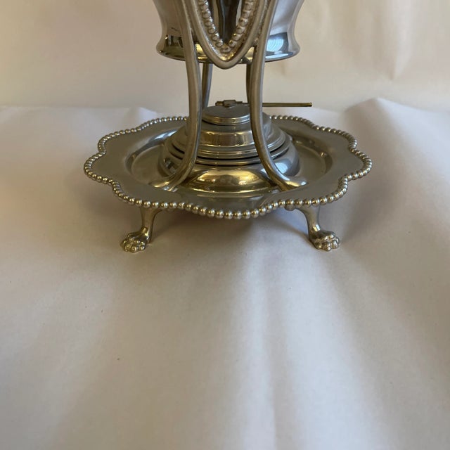 Perfect addition to your sideboard or coffee / tea bar. 1892 Regency style tilting silver plated teapot with refillable...