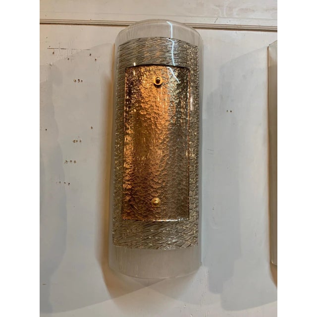 Gorgeous pair of modern Murano glass wall sconces. These have 3 layers of glass each with a different color and texture....