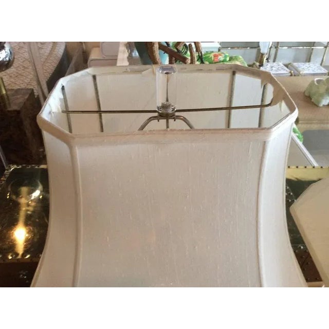 The most amazing pair of Lucite table lamps with original Lucite finials and lamp shades. This is in excellent condition....