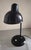 The lampshade is made of sheet metal painted black on the outside and white on the inside to maximise ligzht reflection....