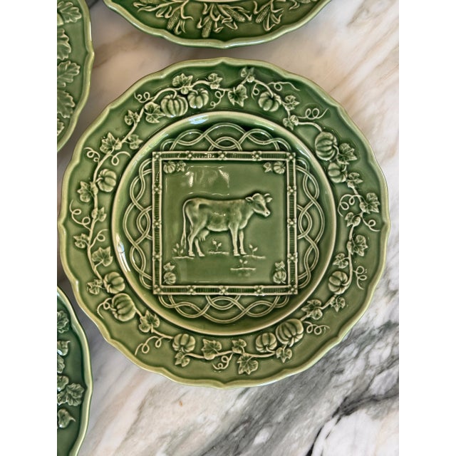 Here is a set of four Bordallo Pinheiro farm motif plates in excellent vintage condition. Made in Portugal. Order includes...
