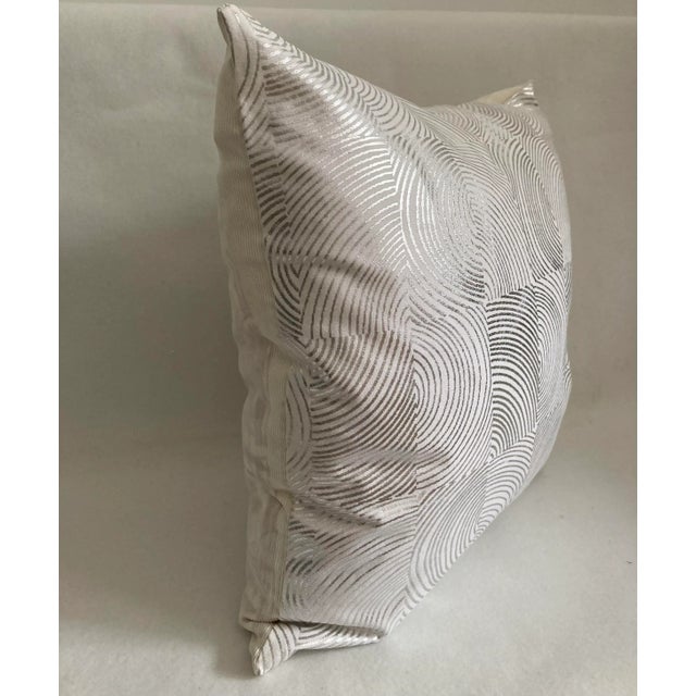 A modern Hollywood Regency inspired pillow cover. A metallic silver abstract moire printed on a white ground. The back is...