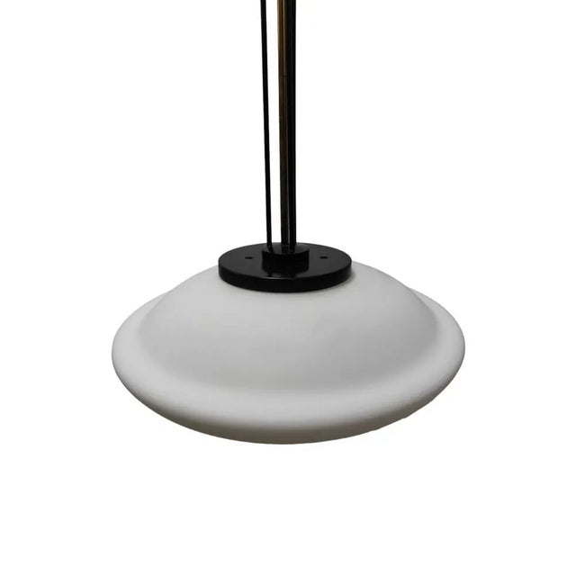 Ceiling lamp dating back to the 70s. White opal glass and aluminum and brass structure. The style is attributable to...