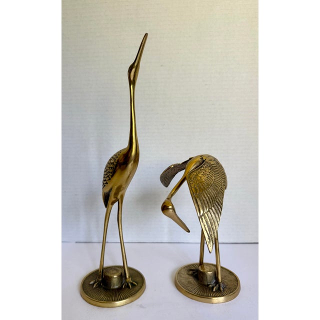 This elegant pair of vintage brass crane sculptures features beautifully elongated forms with detailed featherwork,...