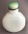 The opaline glass bottle with multifaceted sides served two purposes. The first one was to hold snuff ( residuals of the...