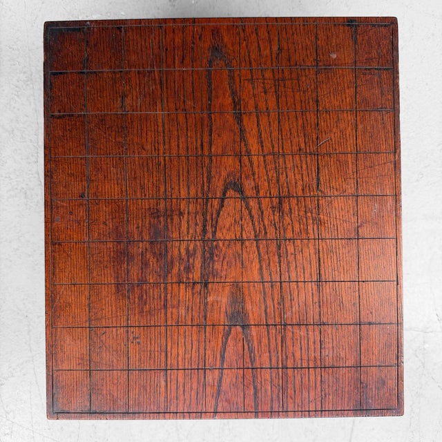 Elegant old Japanese shogi board from 1950's, made in dark reddish-brown wood with a clearly visible playing grid and a...