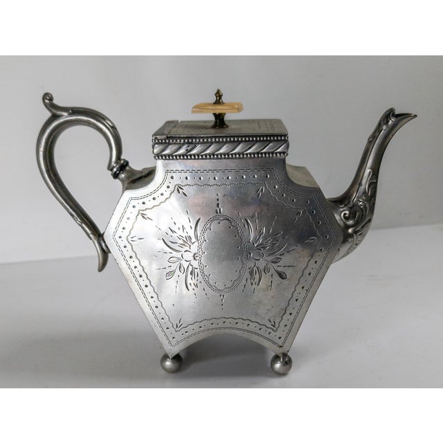 We are selling this great Victorian English Sheffield Silver teapot. This teapot has great form with simple engraving. The...