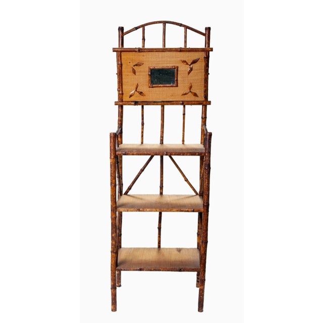 Delicately designed, yet practical for everyday use, this piece features 3 wood shelves covered with removable rattan...
