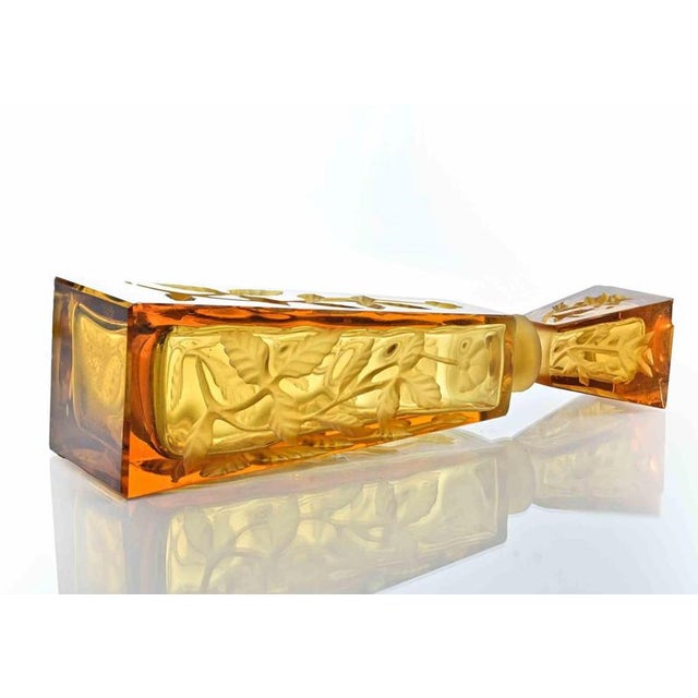 molded amber obelisk-shaped bottle realized in France b J. Lanier in 1930s. Stopper with losses and minor chips, otherwise...