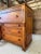 An exceptional American Empire chest of drawers showcasing richly figured tiger maple beautifully contrasted with striking...