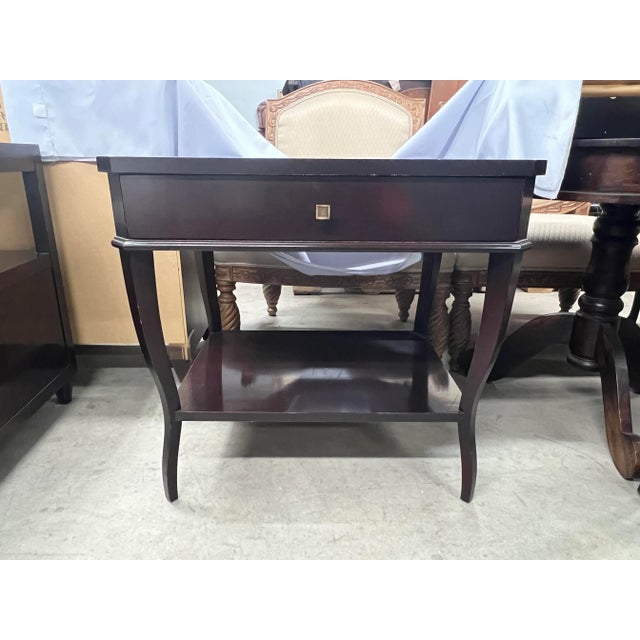 Suzanne Kasler for Hickory Chair. Multipurpose table with drawer and a shelf. Made of solid wood with an espresso brown...