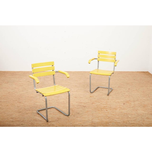 Model 1024 Garden Chairs with Galvanized Steel Tube Frames and Yellow Wooden Slats, 1934, Set of 2, in Good conditions....
