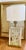 Vintage 1986s Fredrick Ramond Table LampDesign: Hollywood Regency style featuring a frosted glass column with a detailed,...