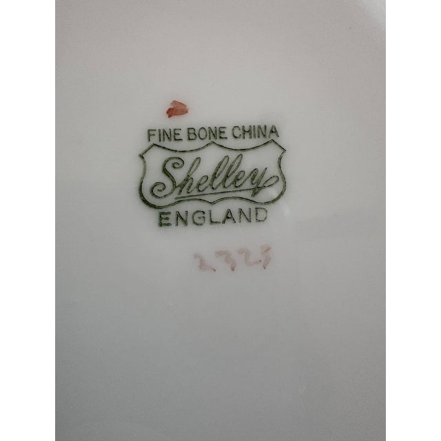 This Shelley Second Wares bone china service for 12 (circa 1966) includes a teapot, a creamer, a sugar bowl, and serving...