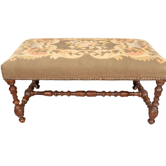 Flemish Baroque Walnut Bench rectangular top upholstered in old needlepoint that needs replacement. Turned legs and...