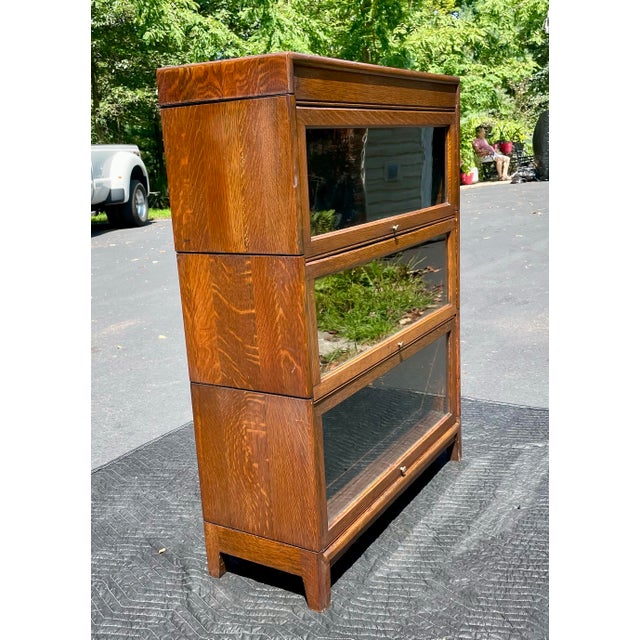 An antique Arts and Crafts barrister bookcase attributed to the Gunn Furniture Company of Grand Rapids Michigan. This...