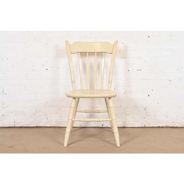 A gorgeous vintage Early American style cream lacquered carved solid maple desk chair, dining chair, or side chair By...