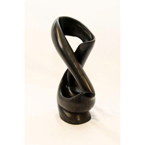 Hand carved black marble abstract art sculpture Perhaps a study in the human form the use of negative space is superb...
