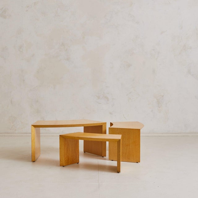 A sculptural set of nesting tables crafted in France in the 1980s. Each table is clad in richly figured burl veneer, its...