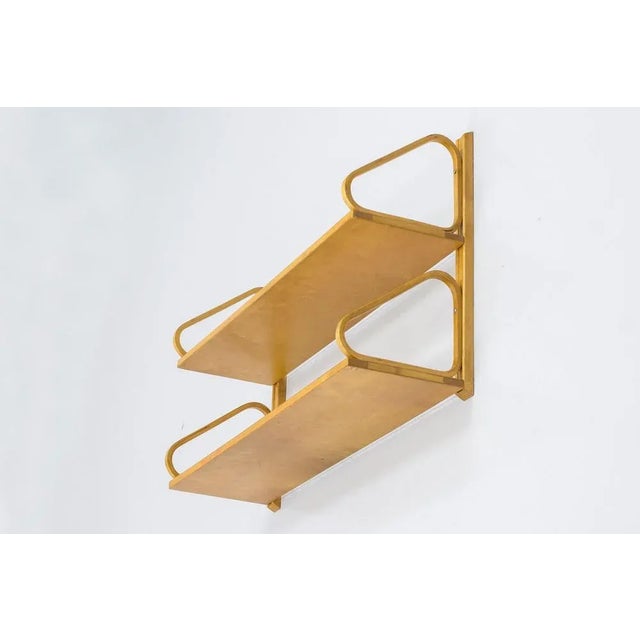 Wall shelf designed by Alvar Aalto. Produced by Svenska Artek in Hedemora, Sweden. Made between 1946-1956. Mad from solid...
