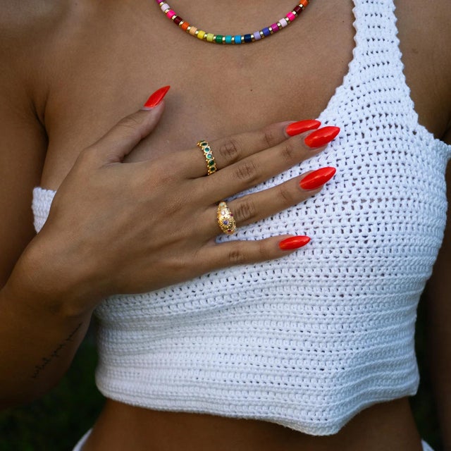 Embrace the timeless elegance of the Majestic Emerald Adjustable Gold Statement Ring.Featuring a radiant emerald...