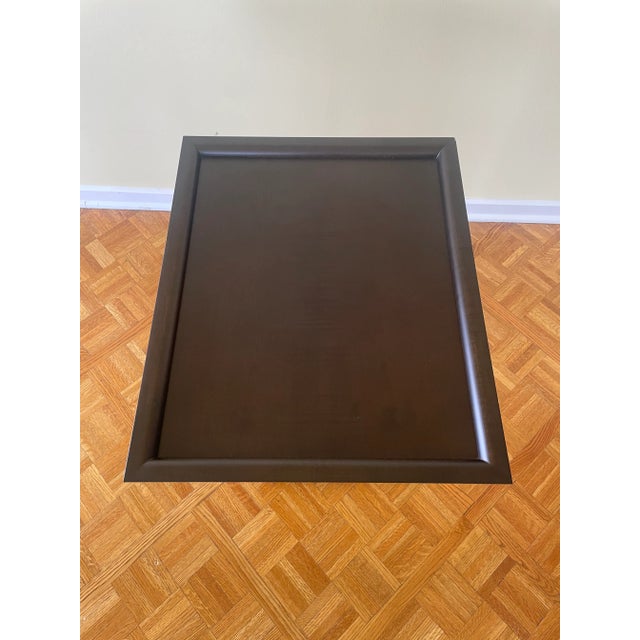 Adjustable height side table with wood top and cast bronze base. Table adjusts in height from post inside leg and hand...