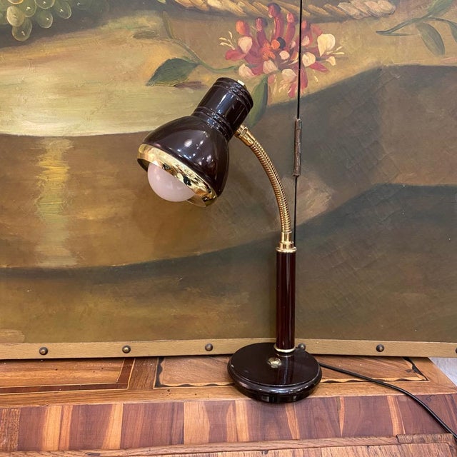 Table lamp with black metal frame and gold details. European Plug (up to 250V).The wiring of this item may be original and...