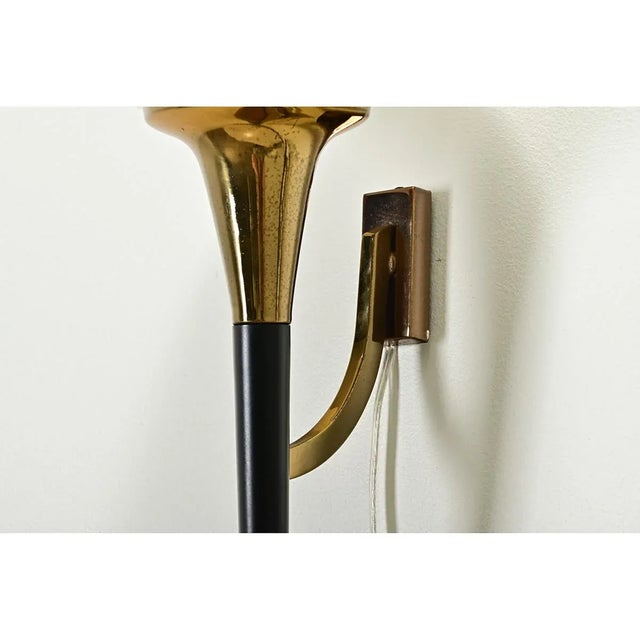 An impressive ensemble of a pair of sconces with matching table lamp, dating to mid-century France. The bulbous glass...