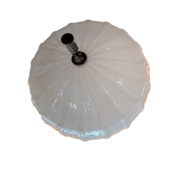 This is rare pair of Edwardian or Art Deco-style flushmount ceiling lights featuring opaline milkglass shades with fluted...