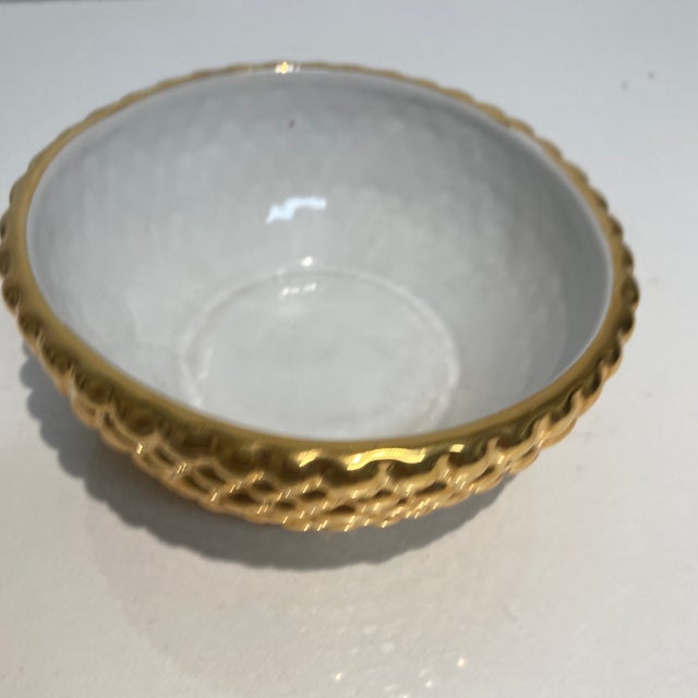 The outside his a dimpled texture in gold the inside is white