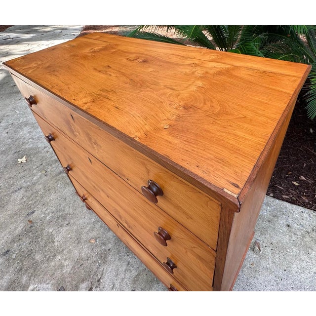Womderful antique cherry wood 4 drawer chest with dovetailed drawers and hand turned black walnut knobs and feet. This...