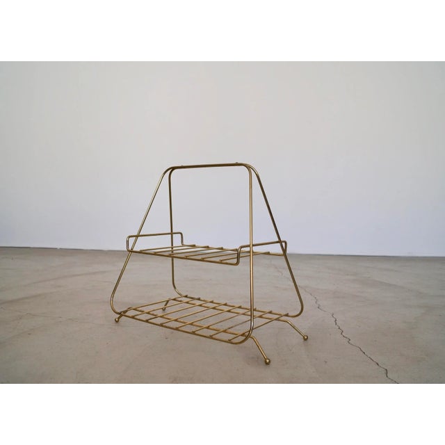 Vintage 1950's Mid century Modern Hollywood Regency magazine or book rack for sale. It's in excellent vintage condition,...