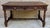 Impressive French writing table dating from the 20th century, crafted in wood and richly decorated with carved floral and...