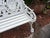 This product is a pair of white antique style cast iron figural seasons garden benches. It is a reproduction of antique...