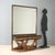 Console with mirror in walnut made in Italy in the mid-20th century, featuring a green serpentine marble top that adds a...