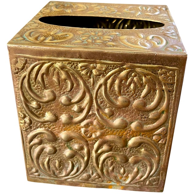 A richly decorative vintage solid brass tissue box cover enveloped in deeply embossed botanical ornament. Scrolling...