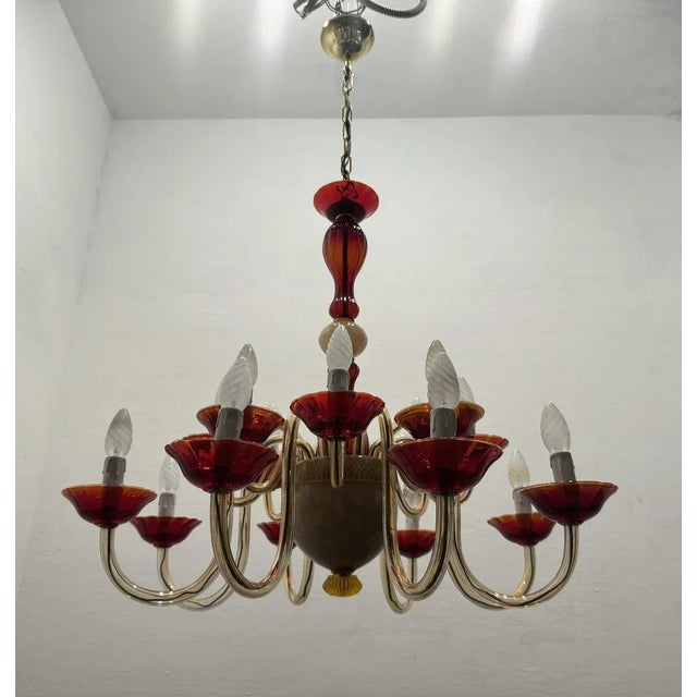 Large venetian murano glass ruby red chandelier 1980’s 16 lights ruby red and golden colored hand blown murano glass....