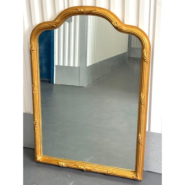 Carvers guild mirror, gold arched with ancuthus leaves. A beautiful mirror. Gold leaf on wood. Beautifully made. Ready to...