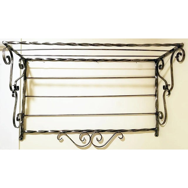 Here's a wrought and polished-to-pewter steel shelf for the bath or kitchen. Sandblasted and hand polished to a silver and...