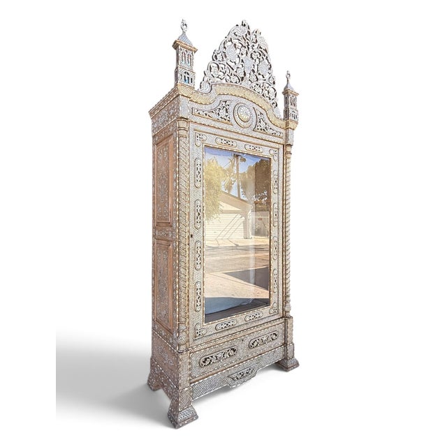 A remarkable late 19th-century Moorish vitrine cabinet, possibly Moroccan, richly decorated throughout with intricate...