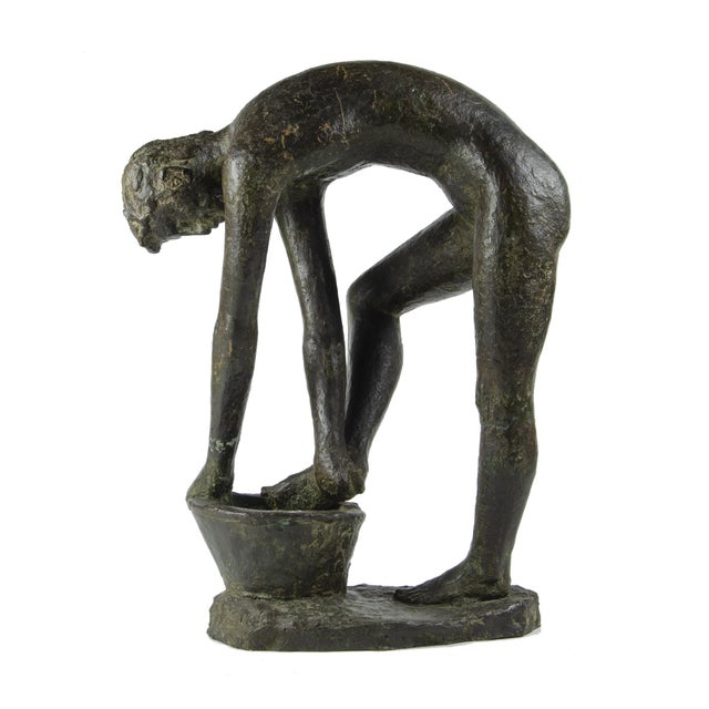 Early 20th century patinated bronze sculpture of a man washing himself over a bucket by Carlos de la Cárcova, Argentina...