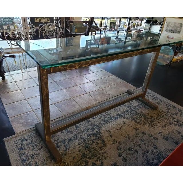 This is a Contemporary Modern Style Brushed Steel Truss Base Glass Top Elongated Raised Rectangular Table (20th/21st...