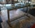 This is a Contemporary Modern Style Brushed Steel Truss Base Glass Top Elongated Raised Rectangular Table (20th/21st...