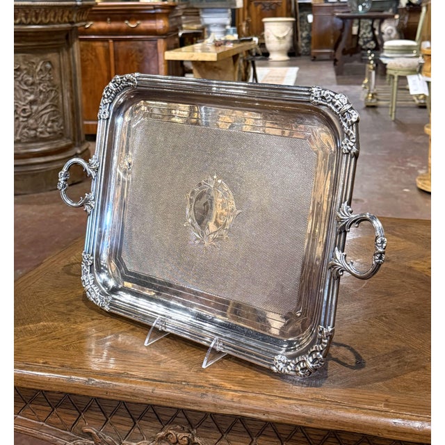 This finely crafted antique serving tray showcases the classical symmetry and decorative refinement of the Louis XVI...